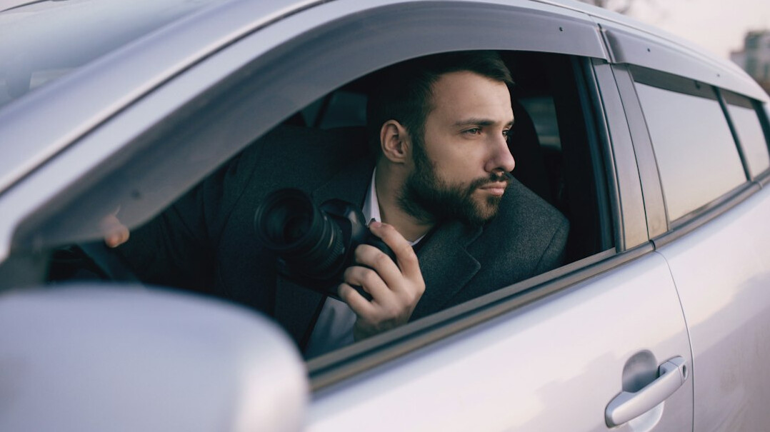 private investigator in car