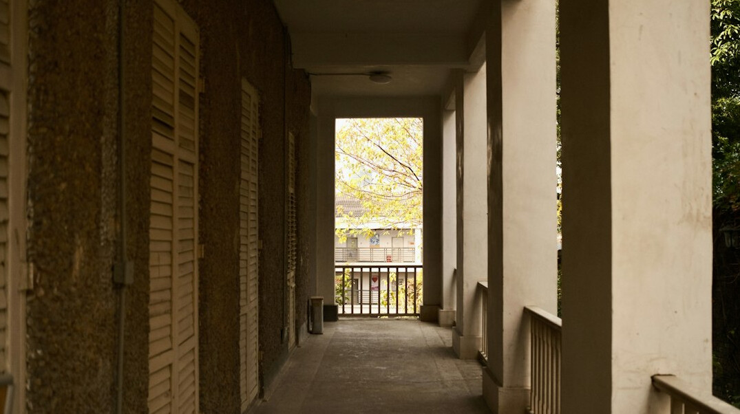 Old apartment building corridor with worn infrastructure