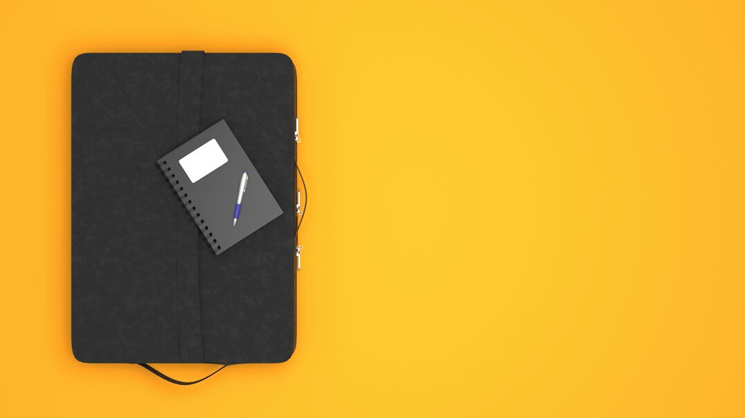 Journalist's notebook, pen and recorder on a desk during an interview